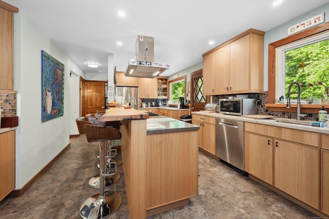 11 College Hill Rd, North Canaan, CT 06018 - kitchen with stainless steel appliances, tasteful backsplash, a kitchen breakfast bar, light brown cabinets, and recessed lighting