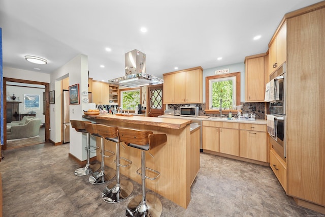 11 College Hill Rd, North Canaan, CT 06018 - kitchen with light brown cabinets, appliances with stainless steel finishes, island range hood, a peninsula, and recessed lighting