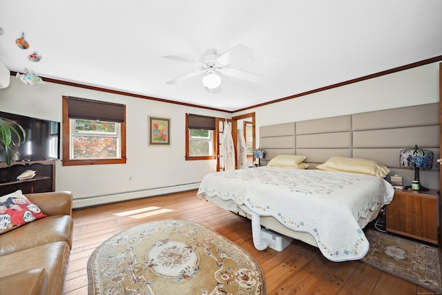 11 College Hill Rd, North Canaan, CT 06018 - bedroom with a baseboard heating unit, wood-type flooring, ornamental molding, and ceiling fan