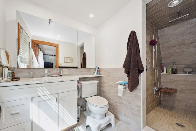 11 College Hill Rd, North Canaan, CT 06018 - full bathroom featuring tiled shower, vanity, tile walls, wainscoting, and recessed lighting