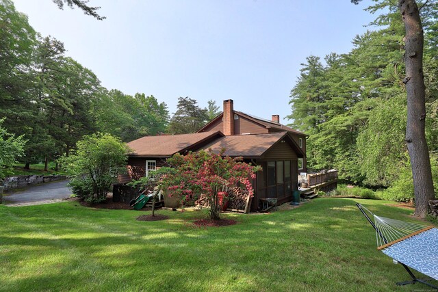11 College Hill Rd, North Canaan, CT 06018 - view of home's exterior featuring a chimney and a lawn