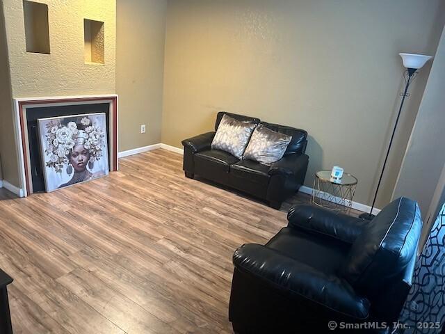 243 Lawlor St Apt 2C, New Britain, CT 06051 - living area with wood finished floors and baseboards