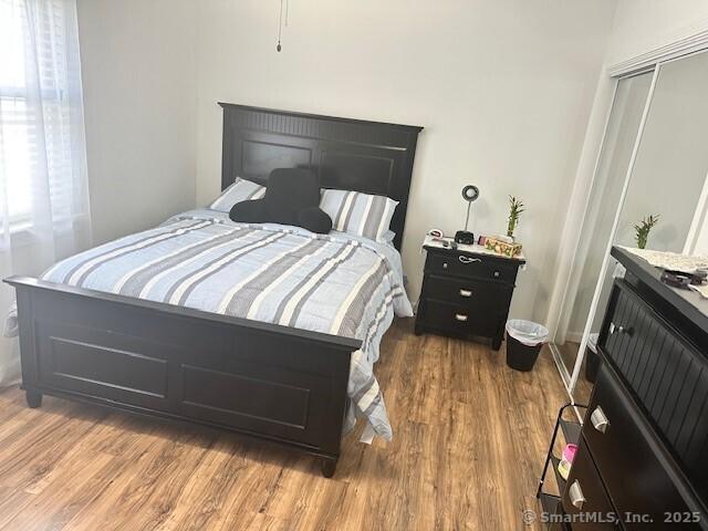 243 Lawlor St Apt 2C, New Britain, CT 06051 - bedroom with wood finished floors