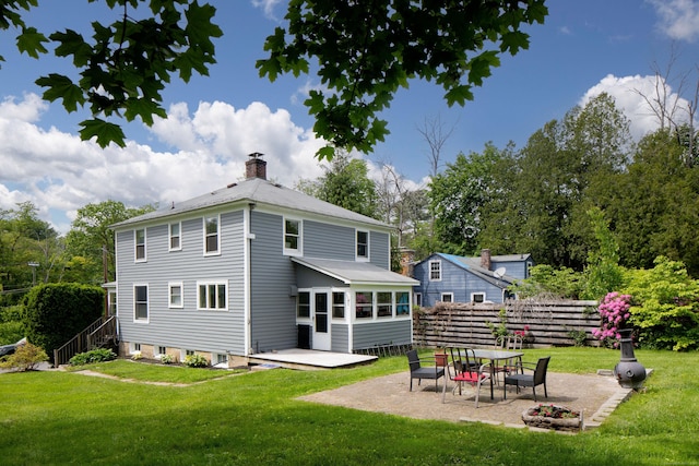 7 Lawrence Ave, North Canaan, CT 06018 - rear view of property featuring a chimney and a patio