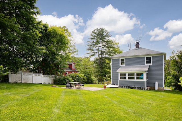 7 Lawrence Ave, North Canaan, CT 06018 - rear view of house with a patio and a chimney
