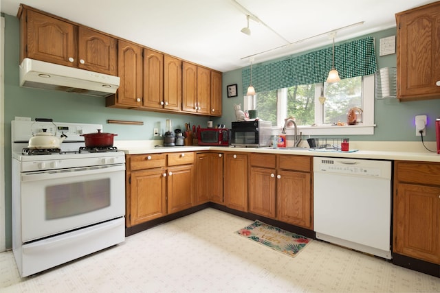 7 Lawrence Ave, North Canaan, CT 06018 - kitchen featuring white appliances, under cabinet range hood, and brown cabinetry