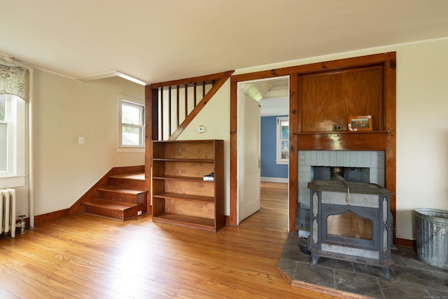 7 Lawrence Ave, North Canaan, CT 06018 - unfurnished living room featuring stairway, wood finished floors, and baseboards