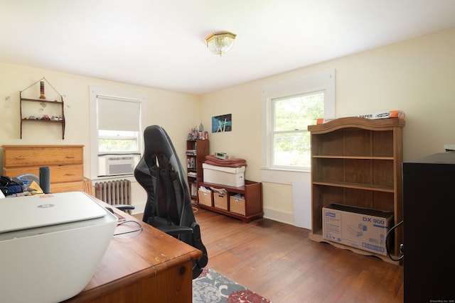 7 Lawrence Ave, North Canaan, CT 06018 - home office with radiator heating unit, wood finished floors, and cooling unit