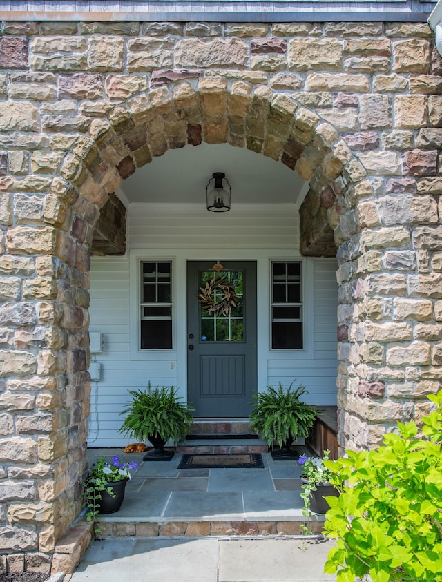 562 Upper Grassy Hill Rd, Woodbury, CT 06798 - view of exterior entry with stone siding and a porch