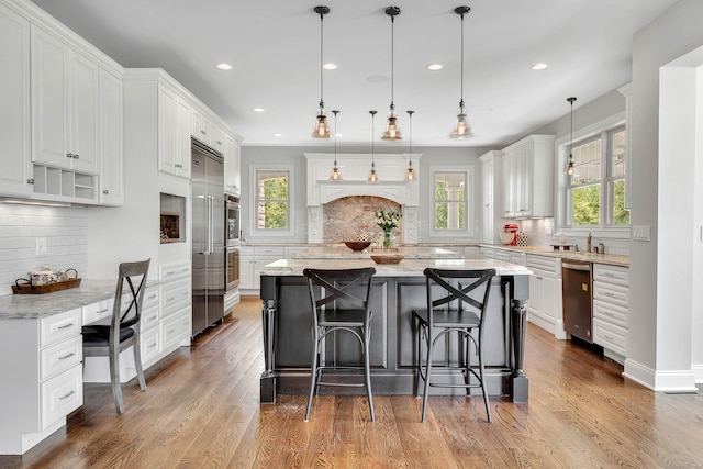 562 Upper Grassy Hill Rd, Woodbury, CT 06798 - kitchen with tasteful backsplash, stainless steel appliances, white cabinetry, plenty of natural light, and recessed lighting