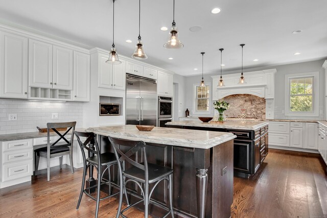 562 Upper Grassy Hill Rd, Woodbury, CT 06798 - kitchen featuring stainless steel appliances, a center island, backsplash, dark wood-style flooring, and recessed lighting