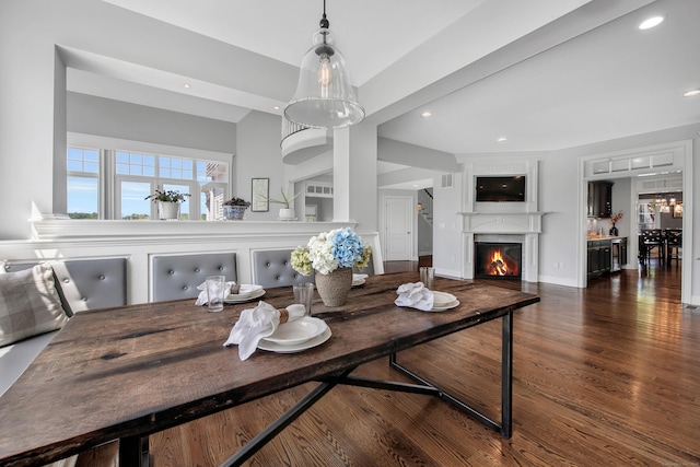 562 Upper Grassy Hill Rd, Woodbury, CT 06798 - dining space with wood finished floors, a glass covered fireplace, and recessed lighting
