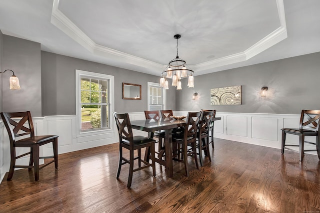 562 Upper Grassy Hill Rd, Woodbury, CT 06798 - dining area featuring a tray ceiling, dark wood finished floors, a chandelier, crown molding, and a decorative wall