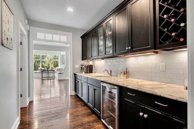 562 Upper Grassy Hill Rd, Woodbury, CT 06798 - indoor wet bar with wine cooler, dark wood-style flooring, tasteful backsplash, and baseboards