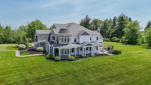 562 Upper Grassy Hill Rd, Woodbury, CT 06798 - rear view of property featuring a yard, a chimney, a porch, and a shingled roof