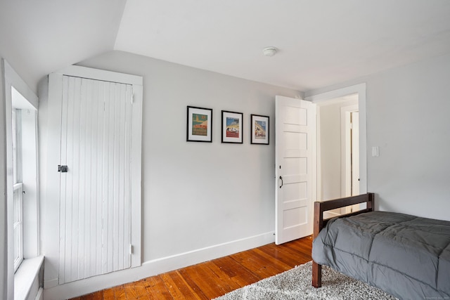 291 Hopmeadow St, Simsbury, CT 06089 - bedroom featuring wood finished floors and lofted ceiling