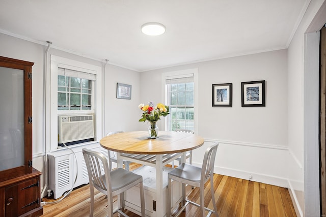 291 Hopmeadow St, Simsbury, CT 06089 - dining room featuring light wood finished floors, crown molding, and cooling unit
