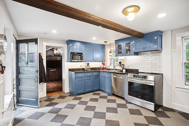 291 Hopmeadow St, Simsbury, CT 06089 - kitchen with blue cabinetry, stainless steel appliances, light flooring, and recessed lighting