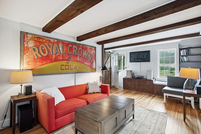 291 Hopmeadow St, Simsbury, CT 06089 - living area with plenty of natural light, hardwood / wood-style flooring, beam ceiling, and a barn door