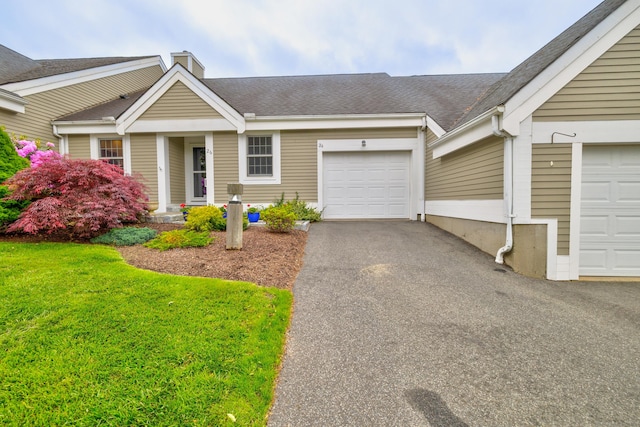 26 Legend Hill Rd Unit 26, Madison, CT 06443 - ranch-style house with a chimney, driveway, an attached garage, a shingled roof, and a front yard