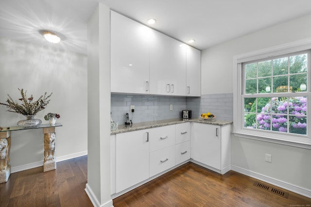 26 Legend Hill Rd Unit 26, Madison, CT 06443 - kitchen featuring dark wood finished floors, light stone counters, white cabinetry, decorative backsplash, and recessed lighting