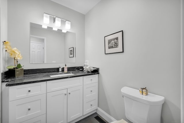 26 Legend Hill Rd Unit 26, Madison, CT 06443 - bathroom featuring vanity, baseboards, and toilet