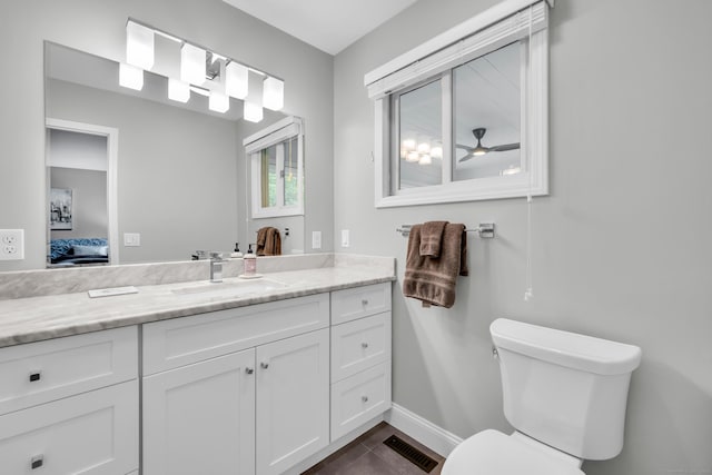 26 Legend Hill Rd Unit 26, Madison, CT 06443 - bathroom with vanity, toilet, ensuite bathroom, baseboards, and tile patterned floors
