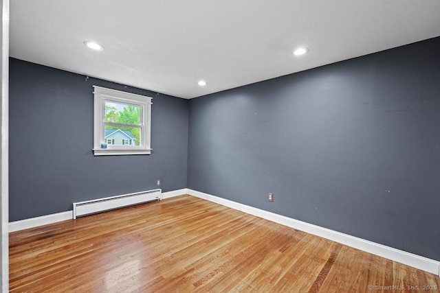 99 Redwood Dr, Bristol, CT 06010 - empty room featuring a baseboard heating unit, wood finished floors, baseboards, and recessed lighting