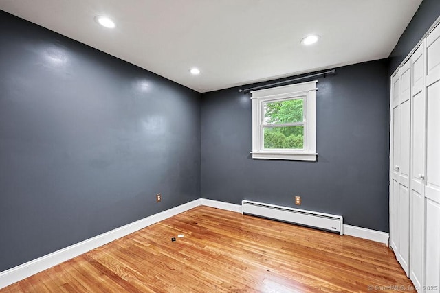 99 Redwood Dr, Bristol, CT 06010 - unfurnished bedroom featuring a baseboard radiator, light wood-style flooring, baseboards, a closet, and recessed lighting