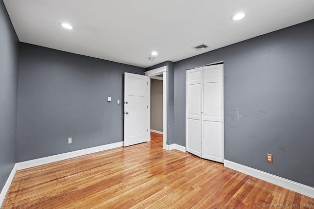 99 Redwood Dr, Bristol, CT 06010 - unfurnished bedroom with baseboards, light wood-style flooring, recessed lighting, and a closet