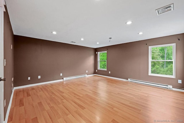 99 Redwood Dr, Bristol, CT 06010 - empty room with a baseboard radiator, light wood finished floors, recessed lighting, and baseboards