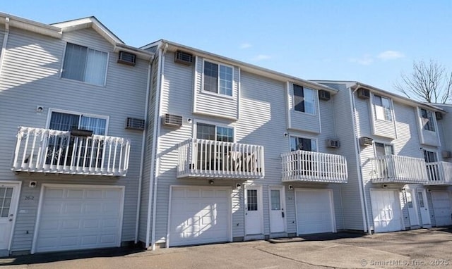 26 Guiel Pl Apt 5, Meriden, CT 06450 - rear view of property featuring an attached garage