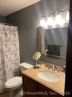 26 Guiel Pl Apt 5, Meriden, CT 06450 - bathroom with vanity, toilet, and a shower with curtain