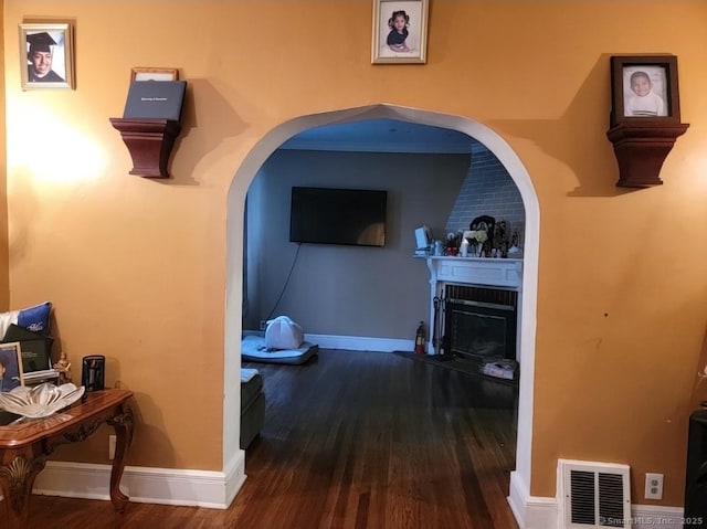 45 Washington Pl, Bridgeport, CT 06604 - hallway featuring wood finished floors, baseboards, and arched walkways