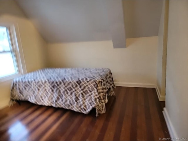 45 Washington Pl, Bridgeport, CT 06604 - bedroom with lofted ceiling, dark wood-style floors, and baseboards
