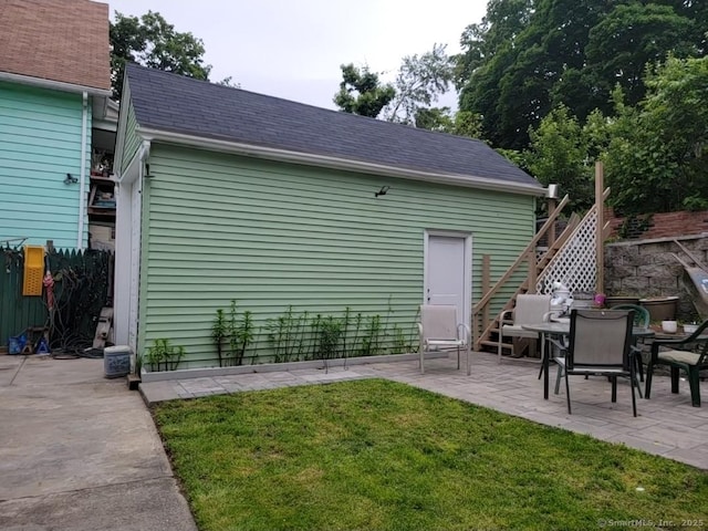 45 Washington Pl, Bridgeport, CT 06604 - back of house featuring a patio and a shingled roof