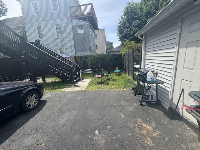 view of parking / parking lot featuring stairs