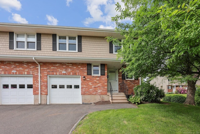 1277 New Britain Ave Unit 1277, West Hartford, CT 06110 - multi unit property with driveway, a front yard, a garage, and brick siding