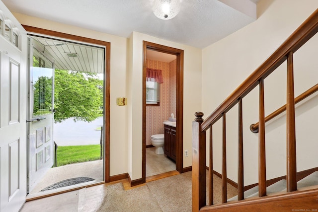 1277 New Britain Ave Unit 1277, West Hartford, CT 06110 - foyer with stairs and baseboards
