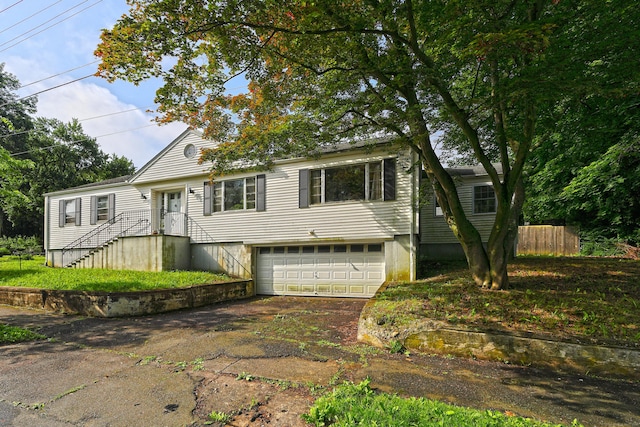 246 Ray Rd, New Haven, CT 06515 - view of front facade with a garage and asphalt driveway