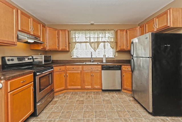 246 Ray Rd, New Haven, CT 06515 - kitchen featuring stainless steel appliances, under cabinet range hood, dark countertops, and brown cabinets