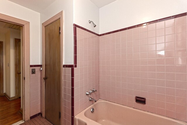 246 Ray Rd, New Haven, CT 06515 - full bathroom with shower / bathtub combination, tile walls, and a wainscoted wall