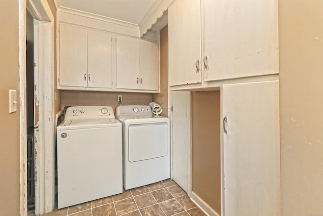 246 Ray Rd, New Haven, CT 06515 - washroom featuring washing machine and clothes dryer, cabinet space, and tile patterned flooring