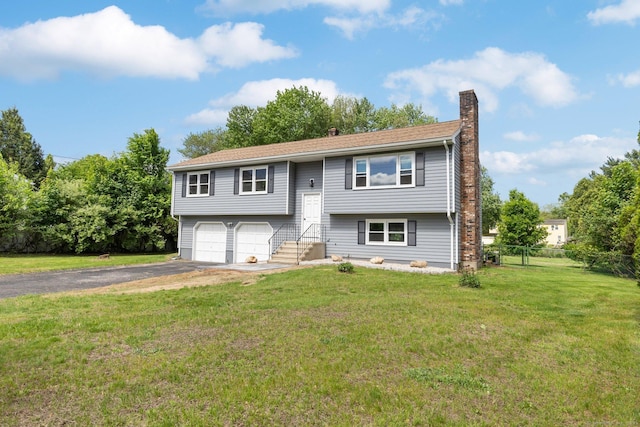 447 Palisado Ave, Windsor, CT 06095 - raised ranch with a chimney, driveway, a garage, and entry steps