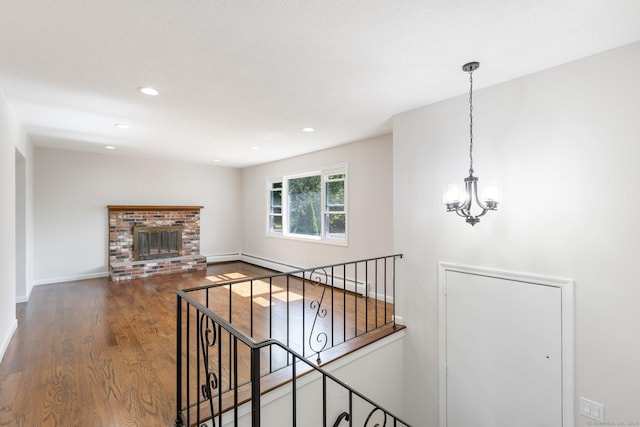 447 Palisado Ave, Windsor, CT 06095 - unfurnished living room with wood finished floors, a baseboard heating unit, a chandelier, recessed lighting, and baseboards