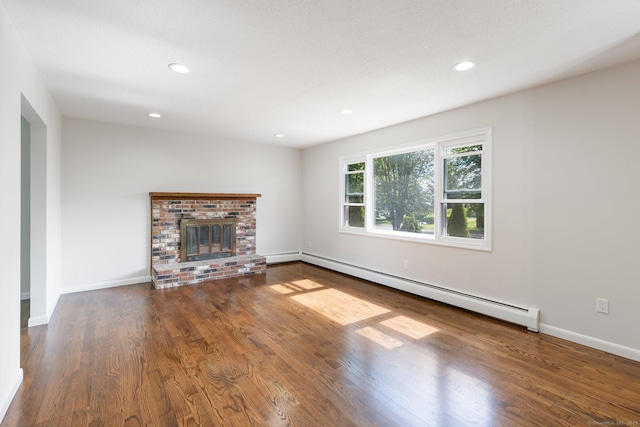 447 Palisado Ave, Windsor, CT 06095 - unfurnished living room featuring baseboard heating, wood finished floors, recessed lighting, a fireplace, and baseboards