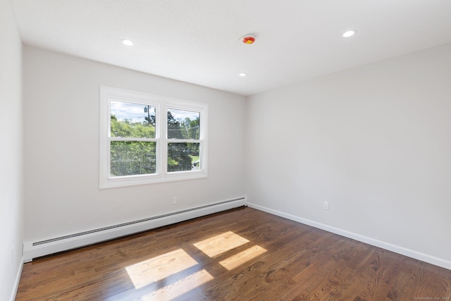 447 Palisado Ave, Windsor, CT 06095 - empty room featuring a baseboard heating unit, wood finished floors, baseboards, and recessed lighting