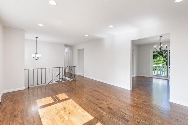 447 Palisado Ave, Windsor, CT 06095 - empty room featuring a chandelier, wood finished floors, recessed lighting, and baseboards