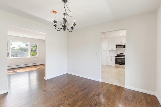 447 Palisado Ave, Windsor, CT 06095 - unfurnished room with a baseboard radiator, a chandelier, wood finished floors, and baseboards