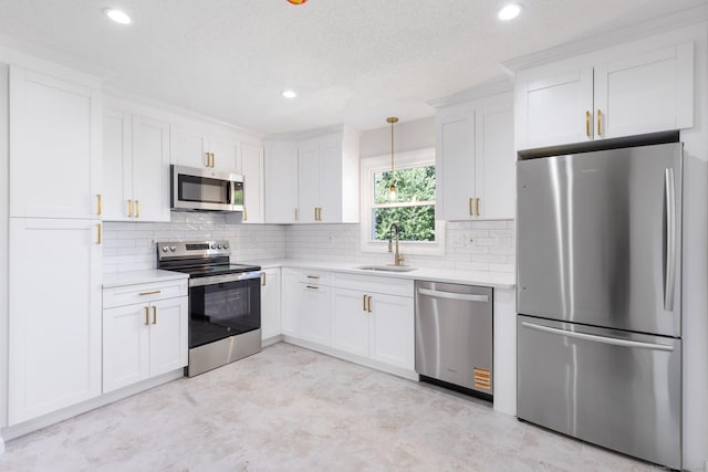 447 Palisado Ave, Windsor, CT 06095 - kitchen with appliances with stainless steel finishes, light countertops, a sink, white cabinetry, and recessed lighting